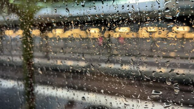 train departing from station with rainy windows in Paris