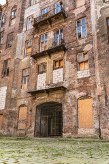 Fototapeta na wymiar The courtyard of a tenement house at 14 Próżna Street, a fragment of the Warsaw Ghetto