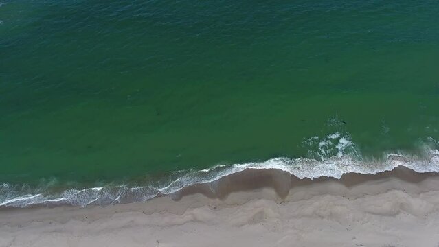 Closeup Ocean Waves Tow Down on Beach at Chatham, Cape Cod Aerial