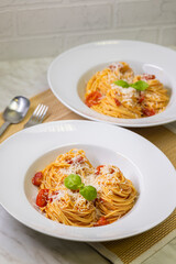 spaghetti with tomatoes, basil and parmesan cheese