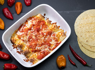 burritos baked with tomato sauce and cheddar cheese