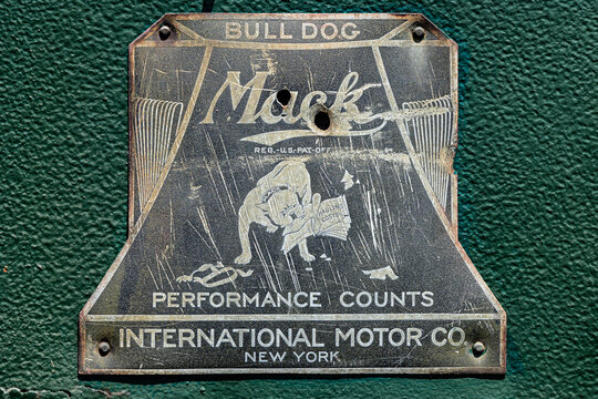 A vintage International Motor Company Mack Bulldog truck symbol.