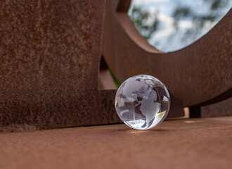 glass earth globe on the rusty iron table