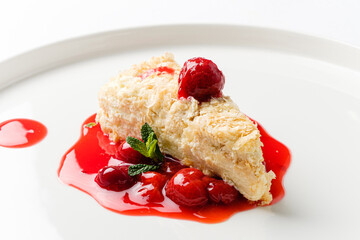 napoleon cake with cherry sauce and mint