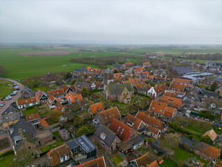 aerial drone photo of the small village Oosterend in Texel, which is an island in the Wadden sea, netherlands.  - obrazy, fototapety, plakaty