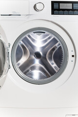 The washing machine - a close up of the display, the manhole and a choice of programs