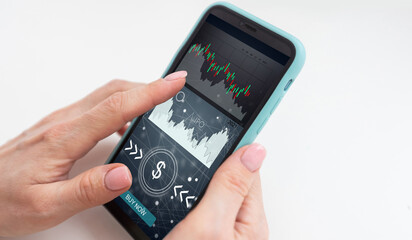 ICO concept - hand clicks on smartphone with abstract graphics.