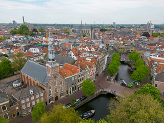 Fototapeta na wymiar This aerial drone photo shows the canal houses and the canal in Leiden. Leiden is a beautiful and old city in Zuid-Holland, the Netherlands. 