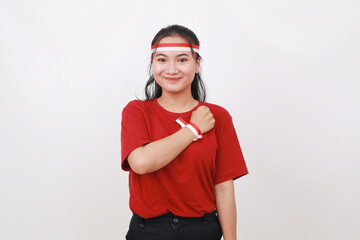 Young Indonesian girl celebrate indonesia independence day with hand on the chest
