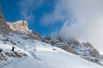 Fototapeta na wymiar Mountain around the winter trail to Rifugio Vajolet from Vigo di Fassa, Dolomites, Italy