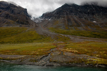 A glacier in the mountains along a hiking trail between Alesjaure and Vistas Mountain Huts, Lapland, Sweden