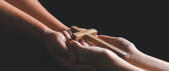 Woman's hand with cross. Concept of hope, faith, christianity, religion, church online. Person...