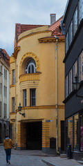 Fototapeta premium A man walking in the streets of Tallinn, Estonia