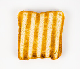 A piece of grilled white toasted bread on a white background. View from above.