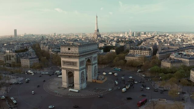 Aerial above Arc de Triumph and Eifel Tower in background at sunrise