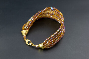 Colorful gemstone beads bracelet, unique handmade jewelry background, promotional photo for an online jewellery store 