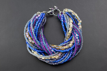 Colorful gemstone beads bracelet, unique handmade jewelry background, promotional photo for an online jewellery store 