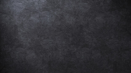 Elegant background texture of a dark stone surface softly lit from one side
