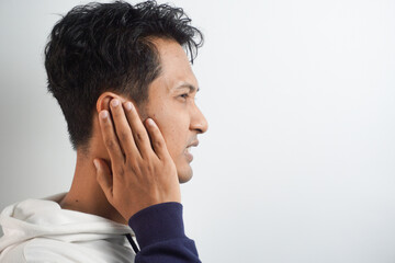 Fototapeta premium Man with earache is holding his aching ear body pain concept