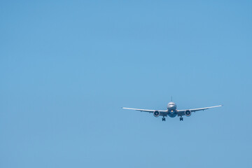 Airplane flying at sky, Airliner passing blue sky ,copy space.