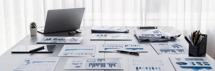 BI data dashboard from Fintech on laptop screen displays comprehensive business analysis in empty office. Technology empowering business financial data visualization and growth strategy. Prodigy