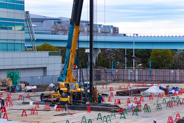 Cranes at the under construction near the railway telephoto shot