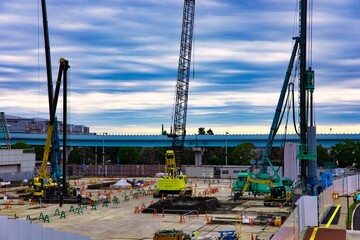Naklejka premium Cranes at the under construction near the railway