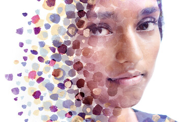 A paintography portrait of a young woman's face combined with paint dots