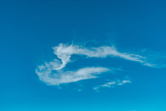 Blue sky and white clouds, Haleakala National Park, Maui, Hawaii. Cirrus uncinus cloud