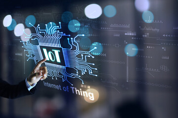 Businessman pointing hand at iot or internet of things to enable connected electronic devices and...