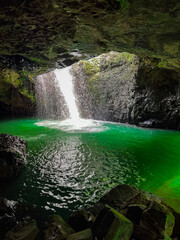 Fototapeta na wymiar Enchanting Wonder: Majestic Australian Waterfall Cascading Inside Captivating Cave