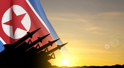 Silhouette of missiles against the sunset with North Korea flag. EPS10 vector