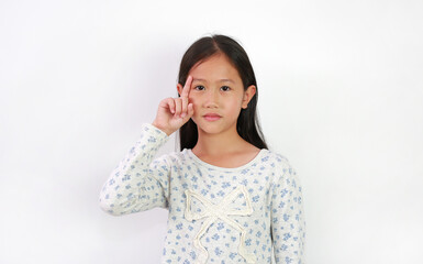 Portrait of Asian young girl kid show one forefinger and look straight at camera on white background.
