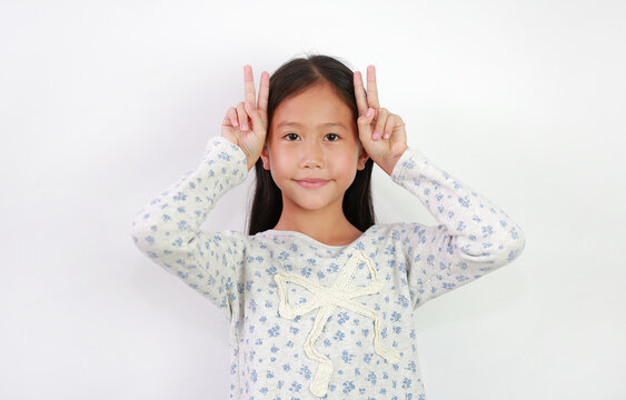 Portrait of Asian girl kid expression like a rabbit over white background.