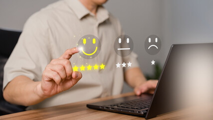 Shopper hand touching the virtual screen on the happy smile face icon for assessment feedback...
