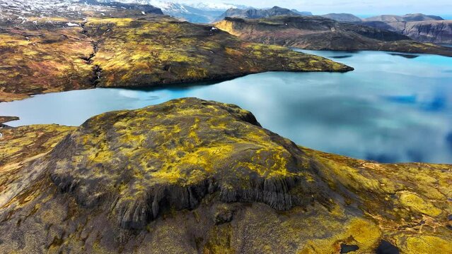 Mountain lake. Picturesque reflection of clouds in clear glacial water. Scenic aerial landscape in Iceland.