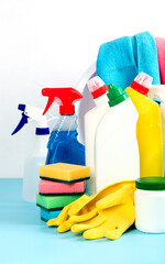 Cleaning products. Bottles, rubber gloves and sponge. Housework concept