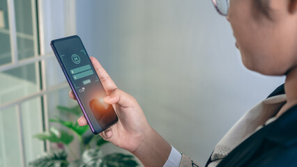 People's fingers are pressing on the phone screen. Represents protection against external hacks,...
