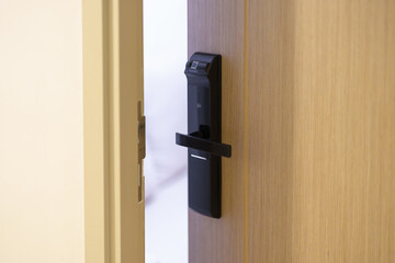 smart digital door lock while open or close the door at home or apartment. NFC Technology, Fingerprint scan, keycard, PIN number, smartphone, electrical and contactless lifestyle concepts
