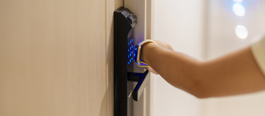 Hand using smartwatch for open digital door lock at home or apartment. NFC Technology, Fingerprint...