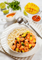 shrimps with beans, mango, brown rice in bowl