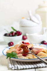 Homemade dumplings with cherries.