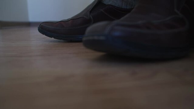 Foot tapping brown dress shoes