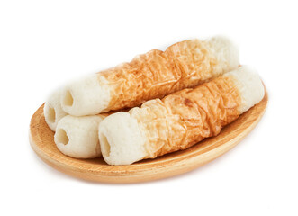 Chikuwa Takebue bake fish cake japanese food in wood plate isolated on white background. Chikuwa Takebue bake fish cake japanese food isolated. Chikuwa Takebue bake fish cake japanese