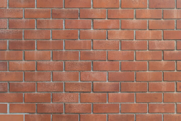 Fototapeta premium Vintage brown bricks block wall with soft lighting background. Grunge wallpaper for decorative or design. Restricted area or obstruction concept.