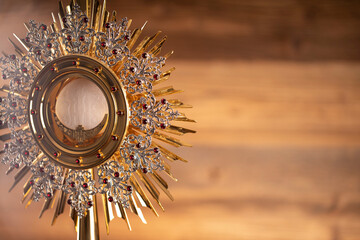Fototapeta Catholic religion concept. First Holy Eucharist.The monstrance. obraz