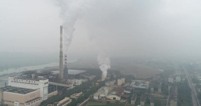 Tiandong County, Baise, Guangxi, China - 
January 15, 2022: Aerial photography of a coal-fired power station and the smog it produces