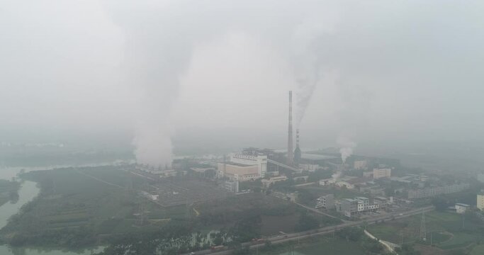Tiandong County, Baise, Guangxi, China - 
January 15, 2022: Aerial photography of a coal-fired power station and the smog it produces