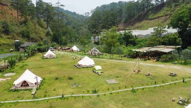 Taking video with drone in the middle of nature campsite birds eye view concept of nature landscape