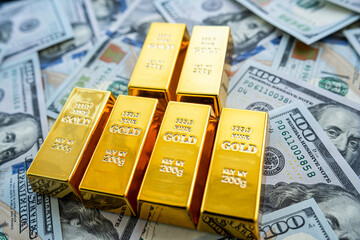 Paper us money with gold bars, saving and investment wealth